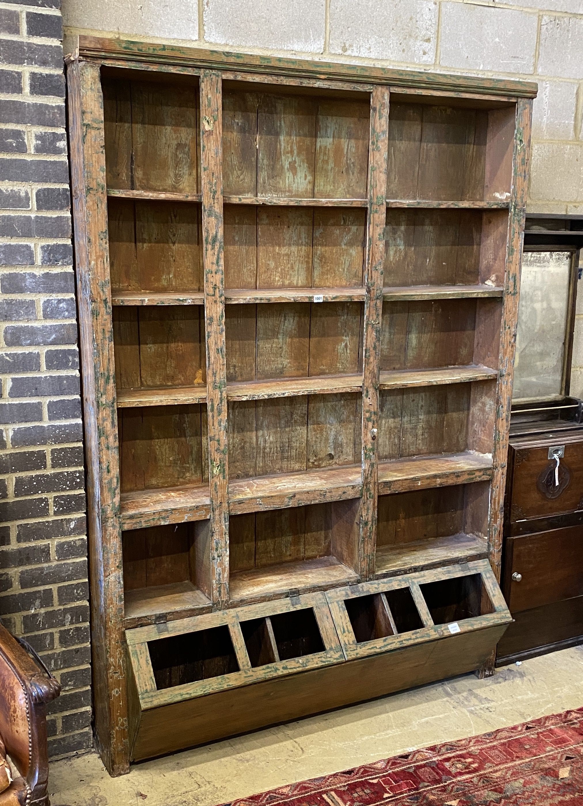 A large 19th century Continental scrubbed pine shop cabinet, width 155cm, depth 38cm, height 219cm